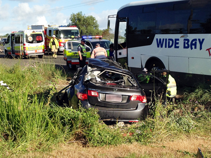 Queensland Fire and Rescue crews worked to free the child after a bus collided with a car on Pialba-Burrum Heads Rd. Queensland Fire and Rescue crews worked to free the child after a bus collided with a car on Pialba-Burrum Heads Rd.