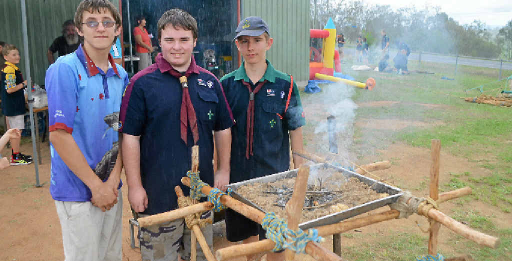 FIRED UP: Jonathon Thompson, Louis Taylor and Dillion Sykes look after the above ground fire at the Glenore Grove Scouts Open Day. FIRED UP: Jonathon Thompson, Louis Taylor and Dillion Sykes look after the above ground fire at the Glenore Grove Scouts Open Day.