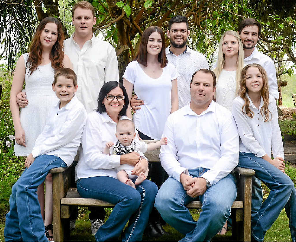 HAPPY FAMILY: Kerry Harrold, his five children and their partners as well as his first grandchild. HAPPY FAMILY: Kerry Harrold, his five children and their partners as well as his first grandchild.