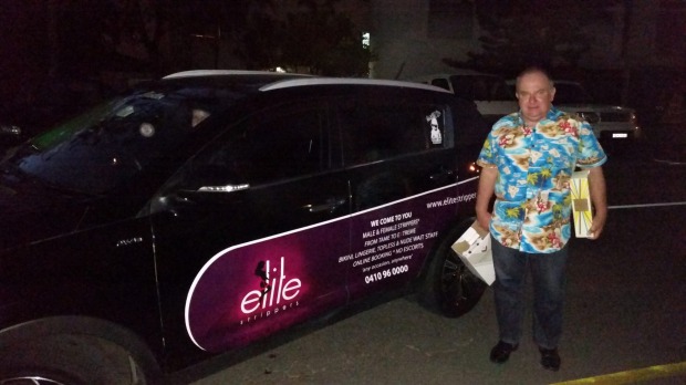 Robert Green with the car Elite Strippers are advertising on the side of which is used for Uber. Photo: Supplied Robert Green with the car Elite Strippers are advertising on the side of which is used for Uber. Photo: Supplied