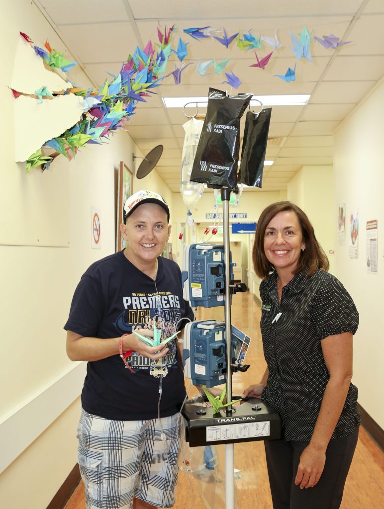 Carolyn Watson and artist Katrina Elliott at the Gladstone Base Cancer Care Unit with some of the paper cranes featured in One Wish, opening at the Gallery & Museum Friday March 4. Photo Contributed Carolyn Watson and artist Katrina Elliott at the Gladstone Base Cancer Care Unit with some of the paper cranes featured in One Wish, opening at the Gallery & Museum Friday March 4. Photo Contributed