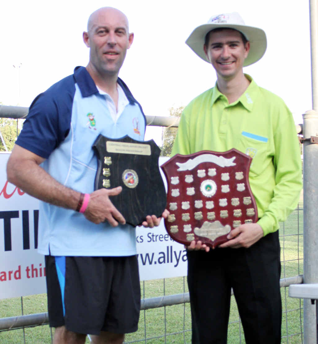 TROPHY: Chris O’Shea with umpire Damian Freiberg and the coveted trophy. TROPHY: Chris O’Shea with umpire Damian Freiberg and the coveted trophy.