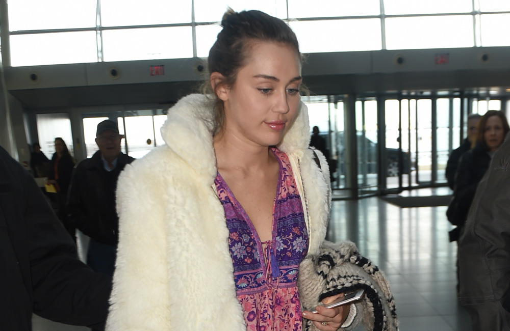 A source claims Miley Cyrus is settling down. A source claims Miley Cyrus is settling down.