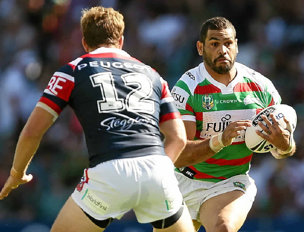 COMING THROUGH: Souths skipper Greg Inglis takes on the Roosters’ defence. COMING THROUGH: Souths skipper Greg Inglis takes on the Roosters’ defence.
