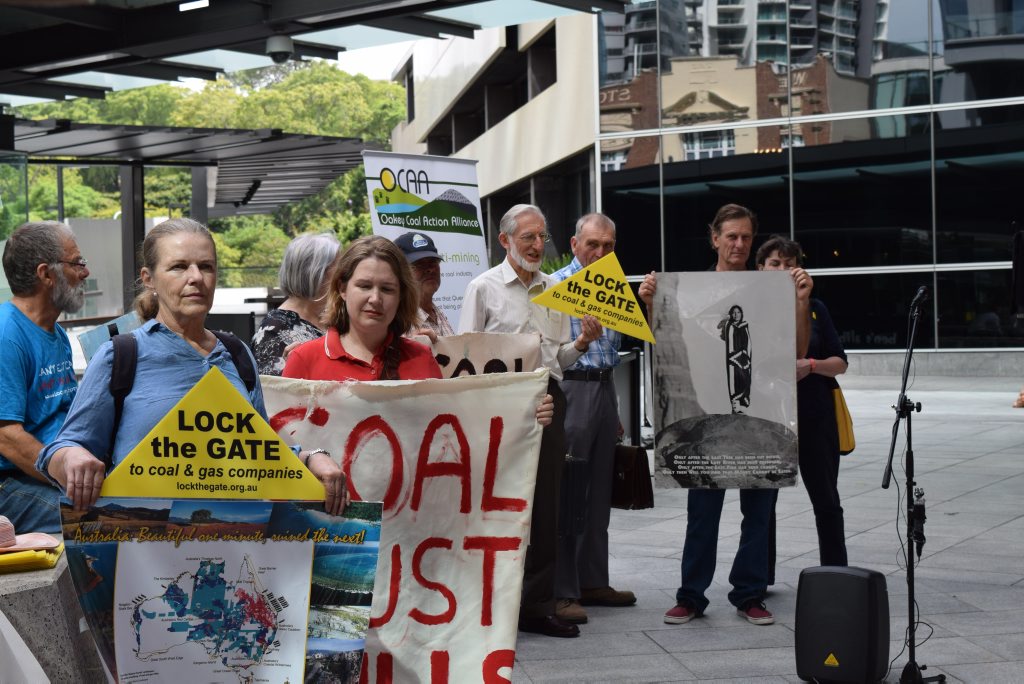 Anti-mining protesters outside the Brisbane Magistrates Court. Anti-mining protesters outside the Brisbane Magistrates Court.