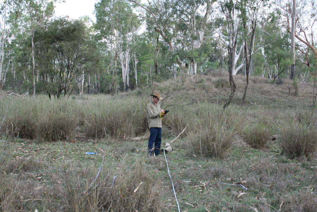 A landholder performs a vegetation assessment of his property. A landholder performs a vegetation assessment of his property.