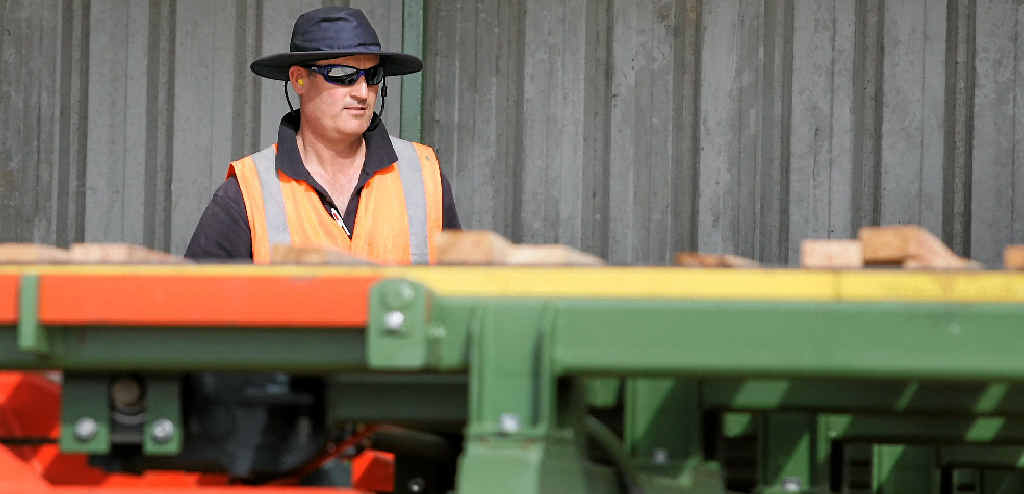 BETTER TIMES: Dressed timber moves along a production line to be bundled on to pallets for distribution at the TMS Milling plant at Bondoola. BETTER TIMES: Dressed timber moves along a production line to be bundled on to pallets for distribution at the TMS Milling plant at Bondoola.