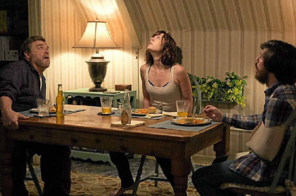 John Goodman, Mary Elizabeth Winstead and John Gallagher Jr in a scene from 10 Cloverfield Lane. John Goodman, Mary Elizabeth Winstead and John Gallagher Jr in a scene from 10 Cloverfield Lane.