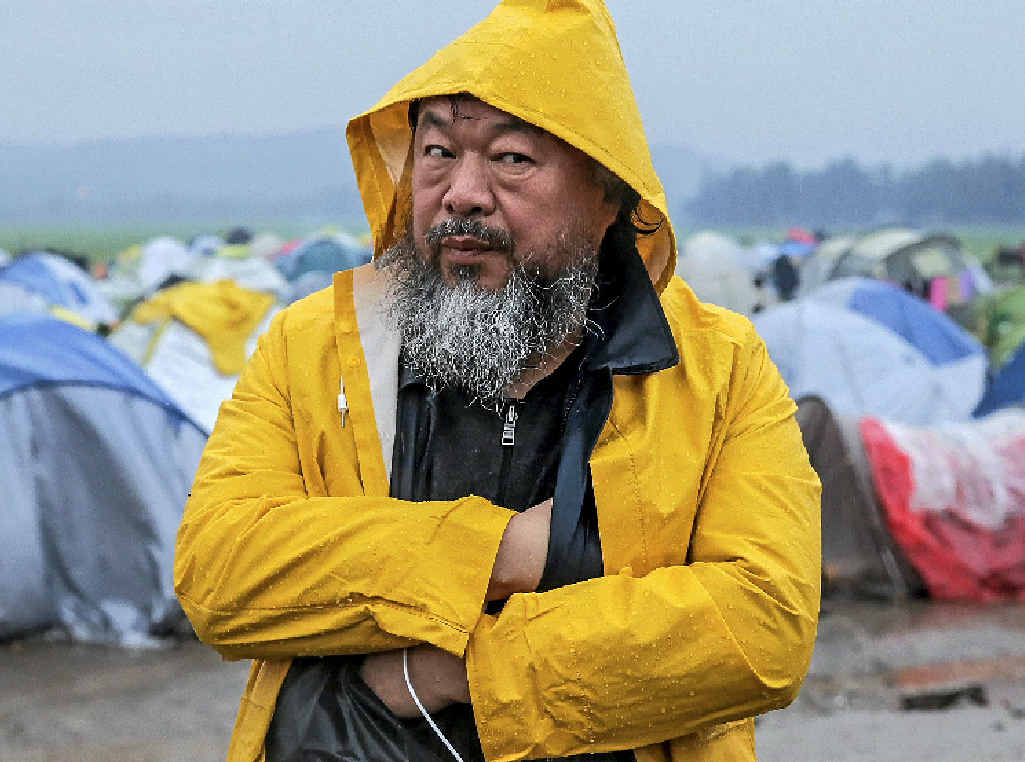 DRAWING ATTENTION: Chinese artist and activist Ai Weiwei visits refugees at a camp near Idomeni, on the border between Greece and Macedonia. The artist has been focusing on the plight of refugees in recent months, spending time living on the Greek island of Lesbos. DRAWING ATTENTION: Chinese artist and activist Ai Weiwei visits refugees at a camp near Idomeni, on the border between Greece and Macedonia. The artist has been focusing on the plight of refugees in recent months, spending time living on the Greek island of Lesbos.