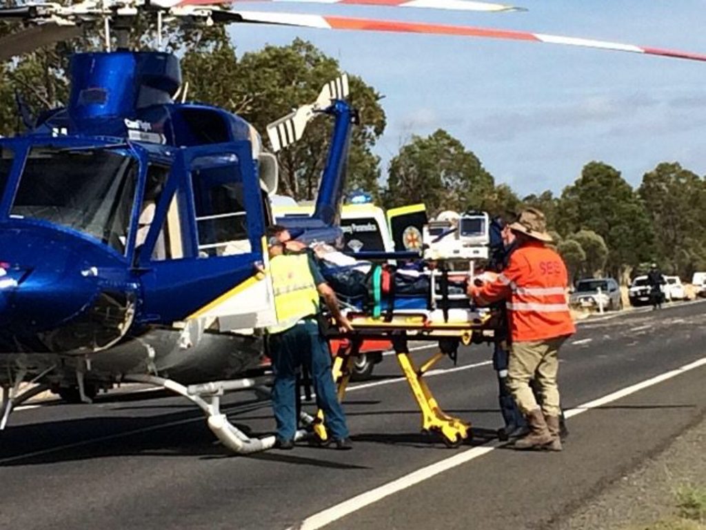 Patients are loaded into a rescue helicopter from the scene of a fatal crash on the Warrego Hwy. Patients are loaded into a rescue helicopter from the scene of a fatal crash on the Warrego Hwy.