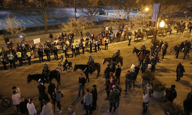 Chicago police officers on foot and mounted, watch over protesters after a rally for Republican presidential candidate Donald Trump was cancelled due to security concerns, on the campus of the University of Illinois-Chicago, Friday, March 11, 2016, in Chicago. Chicago police officers on foot and mounted, watch over protesters after a rally for Republican presidential candidate Donald Trump was cancelled due to security concerns, on the campus of the University of Illinois-Chicago, Friday, March 11, 2016, in Chicago.
