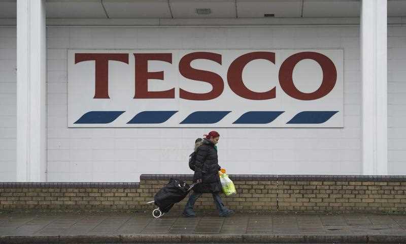 A woman walks past a Tesco supermarket store in London, Britain, 26 January 2016. A woman walks past a Tesco supermarket store in London, Britain, 26 January 2016.