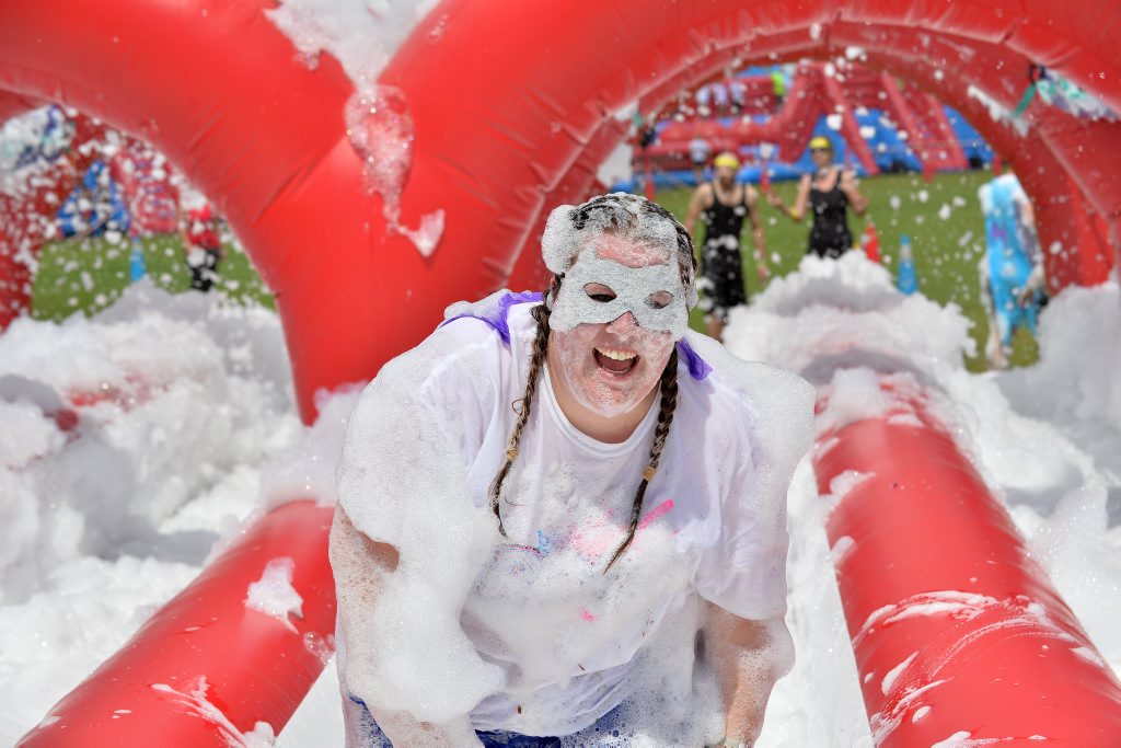 Image for sale: ROC Race is the orginal game show-inspired obstacle run featuring larger than life obstacles, including the infamous Wrecking Ball. Tabitha Kempf (silver mask). Photo Patrick Woods / Sunshine Coast Daily
