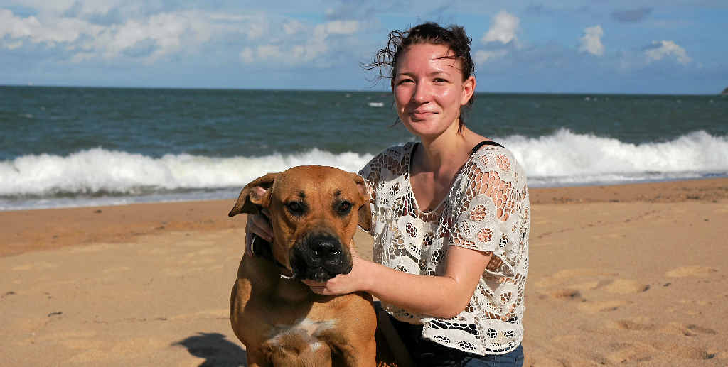 NOT CONCERNED: Hannah Partridge, with her dog Charlie, at Lamberts Beach yesterday reminds readers that the ocean is the crocodile’s habitat. NOT CONCERNED: Hannah Partridge, with her dog Charlie, at Lamberts Beach yesterday reminds readers that the ocean is the crocodile’s habitat.