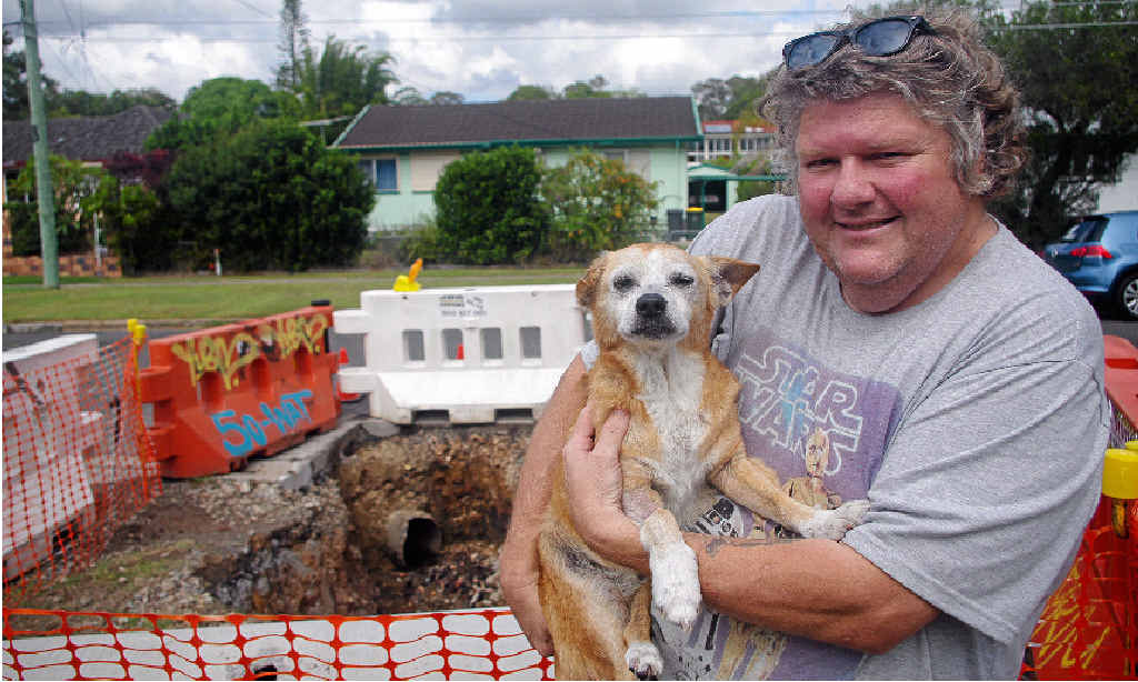 Scamp the 18-year-old dog was rescued from a drain in Brighton after his owner Craig Guild heard barks for help. Photo: Renee McKeown. Scamp the 18-year-old dog was rescued from a drain in Brighton after his owner Craig Guild heard barks for help. Photo: Renee McKeown.