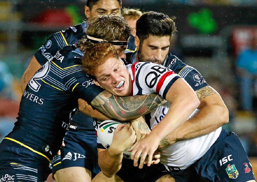 CAUGHT: The Roosters’ Dylan Napa tackled by Cowboys’ Ethan Lowe and James Tamou. CAUGHT: The Roosters’ Dylan Napa tackled by Cowboys’ Ethan Lowe and James Tamou.