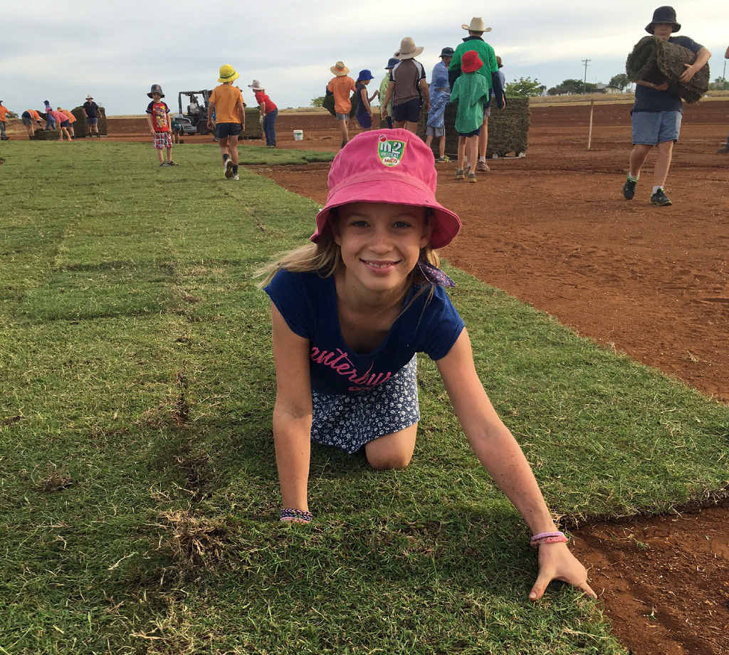 HOME TURF: Felicity York is all smiles after she turned out to lay turf at the Rolleston Community Oval earlier this month. HOME TURF: Felicity York is all smiles after she turned out to lay turf at the Rolleston Community Oval earlier this month.