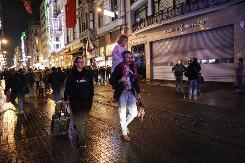 Tourists walk on the street near the scene of a bomb explosion in the downtown Istiklal Street earlier the same day, in Istanbul, Turkey, 19 March 2016. The suicide bomb explosion according to media reports caused the lives of at least five people whil 36 others - among them a dozen foreigners - were injured in the blast, some of them seriously. Tourists walk on the street near the scene of a bomb explosion in the downtown Istiklal Street earlier the same day, in Istanbul, Turkey, 19 March 2016. The suicide bomb explosion according to media reports caused the lives of at least five people whil 36 others - among them a dozen foreigners - were injured in the blast, some of them seriously.