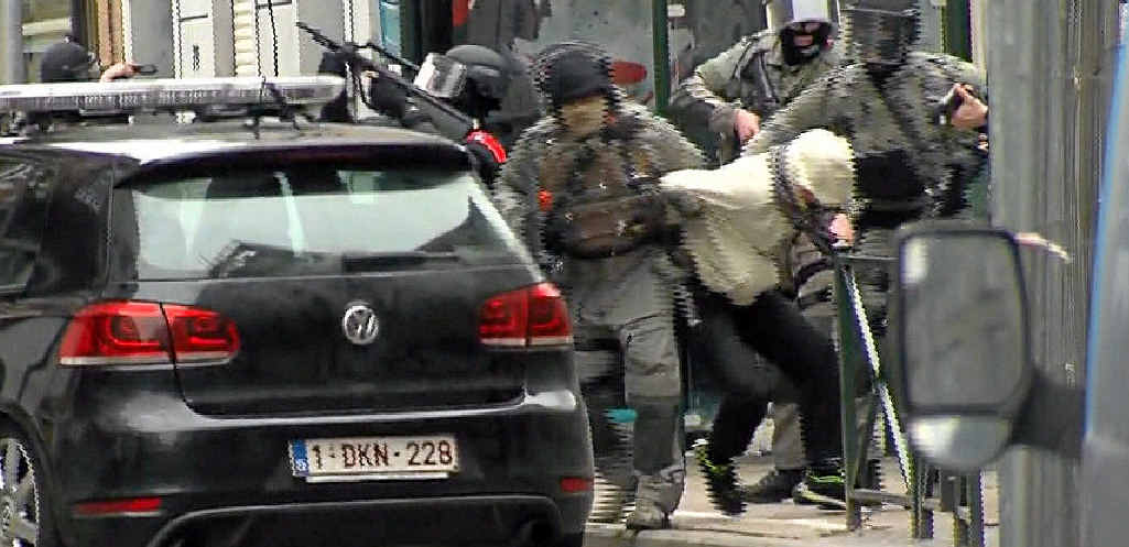 GOTCHA: Suspected terrorist Salah Abdeslam is dragged to a waiting police car in Brussels on Friday. GOTCHA: Suspected terrorist Salah Abdeslam is dragged to a waiting police car in Brussels on Friday.
