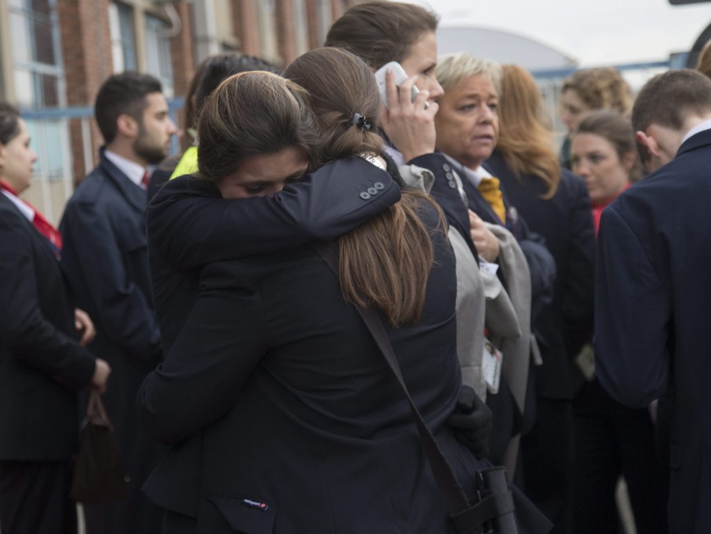 epa05225100 Passengers and airport staff are evacuated from the terminal building after explosions at Brussels Airport in Zaventem near Brussels, Belgium, 22 March 2016. Dozens of people have died or been injured in a double blast in the departure hall of Zaventem Airport in Brussels, Belgian media reported. EPA/OLIVIER HOSLET epa05225100 Passengers and airport staff are evacuated from the terminal building after explosions at Brussels Airport in Zaventem near Brussels, Belgium, 22 March 2016. Dozens of people have died or been injured in a double blast in the departure hall of Zaventem Airport in Brussels, Belgian media reported. EPA/OLIVIER HOSLET