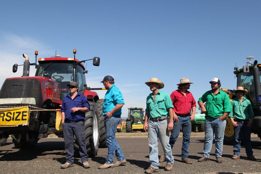 AUSTRALIA, Liverpool Plains: Protesting farmers form a line in front of their tractors in Breeza on August 21, 2015 to protest Shenhua's plans to build a coal mine. The $1.2 billion Watermark coal mine, to be built by the Chinese state-owned company, was given Federal approval in early July of this year, causing controversy (AAP Image/NEWZULU/KATE AUSBURN). NO ARCHIVING, CROWD SOURCED CONTENT, EDITORIAL USE ONLY AUSTRALIA, Liverpool Plains: Protesting farmers form a line in front of their tractors in Breeza on August 21, 2015 to protest Shenhua's plans to build a coal mine. The $1.2 billion Watermark coal mine, to be built by the Chinese state-owned company, was given Federal approval in early July of this year, causing controversy (AAP Image/NEWZULU/KATE AUSBURN). NO ARCHIVING, CROWD SOURCED CONTENT, EDITORIAL USE ONLY