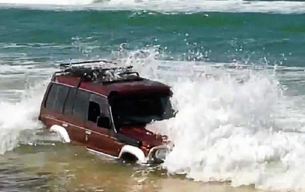 RUINED: A 4WD is swamped after becoming stuck on the Mudlo Rocks at Double Island Point on Friday. RUINED: A 4WD is swamped after becoming stuck on the Mudlo Rocks at Double Island Point on Friday.