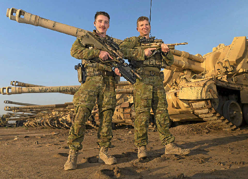 ON TOUR: Gladstone diggers Private Alex Ogilvie and Company Sergeant Major John Craig in Iraq for Task Group Taji. ON TOUR: Gladstone diggers Private Alex Ogilvie and Company Sergeant Major John Craig in Iraq for Task Group Taji.