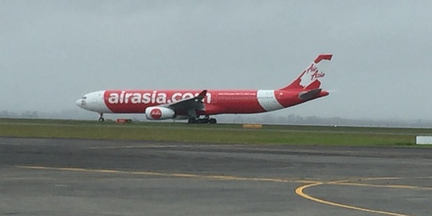 AirAsia X A330-300 lands at Auckland International Airport. AirAsia X A330-300 lands at Auckland International Airport.
