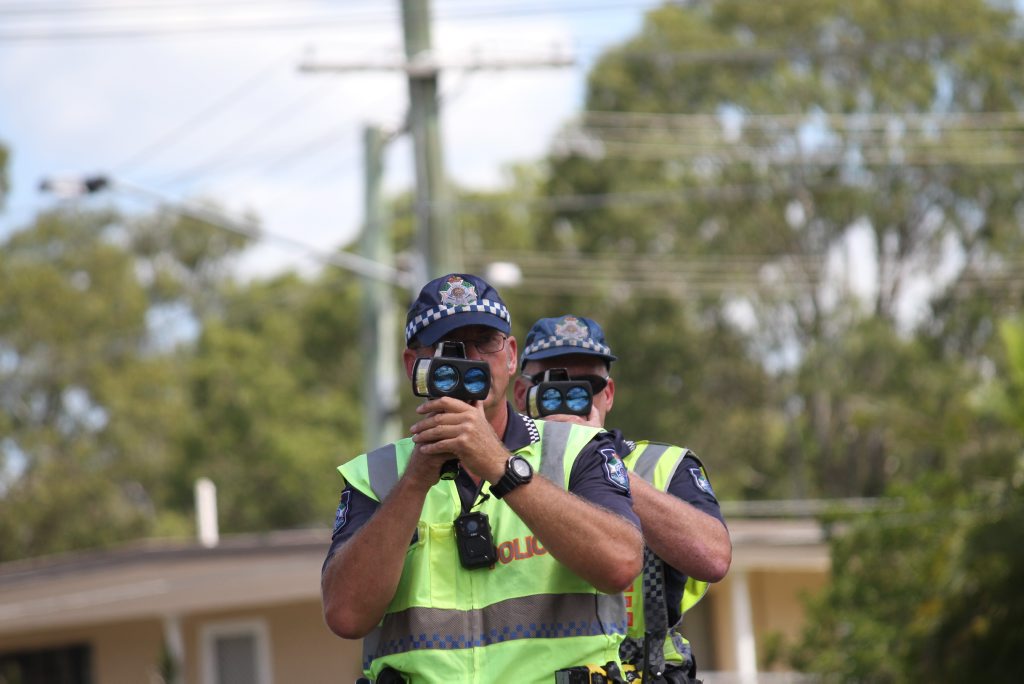 Queensland Road Policing Unit Senior Constable Paul Taylor (front) and Senior Constable Davin Cole check the speeds of people driving in a 70kmh zone. Queensland Road Policing Unit Senior Constable Paul Taylor (front) and Senior Constable Davin Cole check the speeds of people driving in a 70kmh zone.