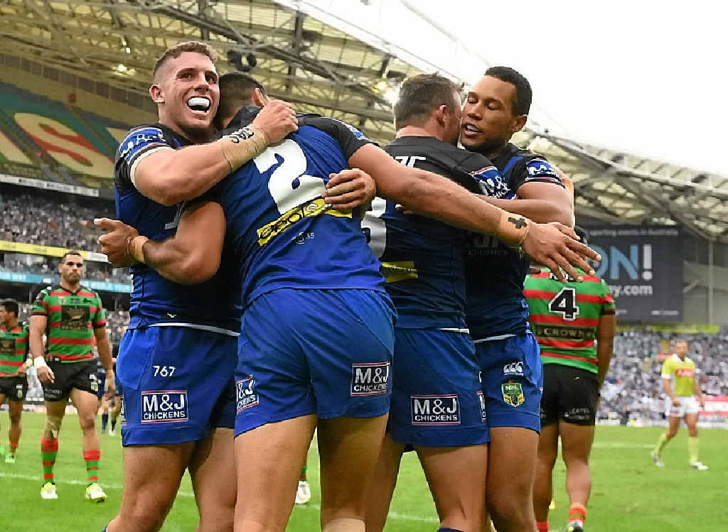 DOG GONE IT: Curtis Rona (second left) celebrates with Bulldogs teammates after scoring another try at ANZ Stadium. DOG GONE IT: Curtis Rona (second left) celebrates with Bulldogs teammates after scoring another try at ANZ Stadium.