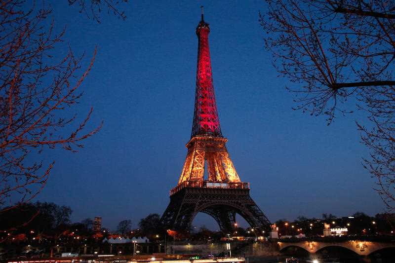 The Eiffel Tower is illuminated with the Belgium national colors black, yellow and red in honor of the victims of the today's attacks at the airport and the metro station in Brussels, in Paris, Tuesday, March 22, 2016. The Eiffel Tower is illuminated with the Belgium national colors black, yellow and red in honor of the victims of the today's attacks at the airport and the metro station in Brussels, in Paris, Tuesday, March 22, 2016.