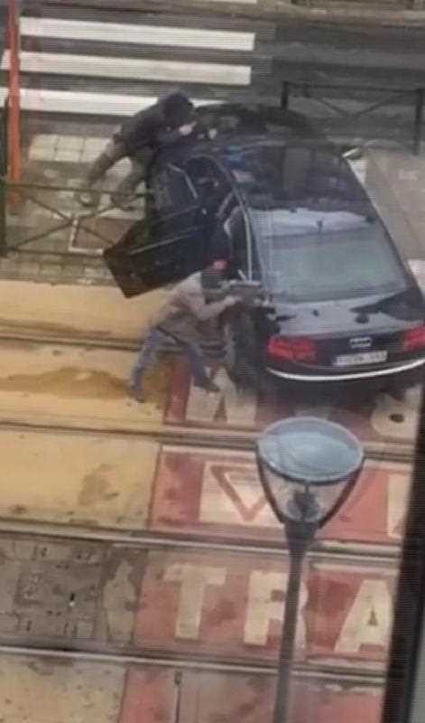In this frame made from video, armed officers point their weapons in the direction of an injured man, in Brussels, Belgium, Friday March 25, 2016. Police again raided a number of Brussels neighbourhoods on Friday in an operation a local official said was linked to both the airport and metro bombings and to the arrest in the Paris suburbs of a man who may have been plotting a new attack in France. In this frame made from video, armed officers point their weapons in the direction of an injured man, in Brussels, Belgium, Friday March 25, 2016. Police again raided a number of Brussels neighbourhoods on Friday in an operation a local official said was linked to both the airport and metro bombings and to the arrest in the Paris suburbs of a man who may have been plotting a new attack in France.