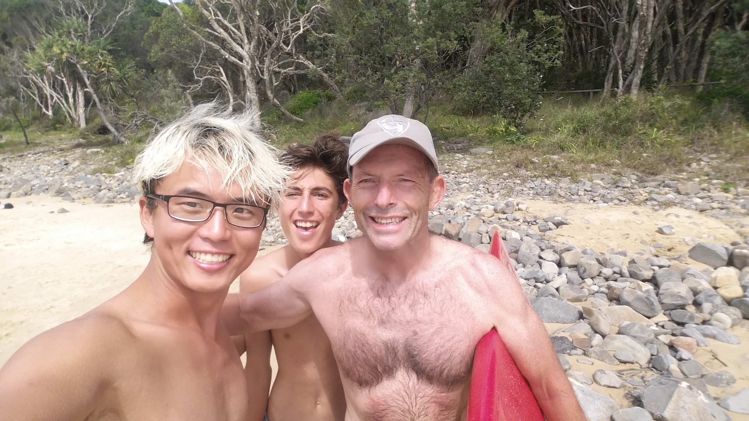 Bongsu Kim (left) from South Korea and Finn Massoud with former Prime Minister Tony Abbott at Tea Tree Bay in Noosa National Park just after lunch today. Bongsu Kim (left) from South Korea and Finn Massoud with former Prime Minister Tony Abbott at Tea Tree Bay in Noosa National Park just after lunch today.
