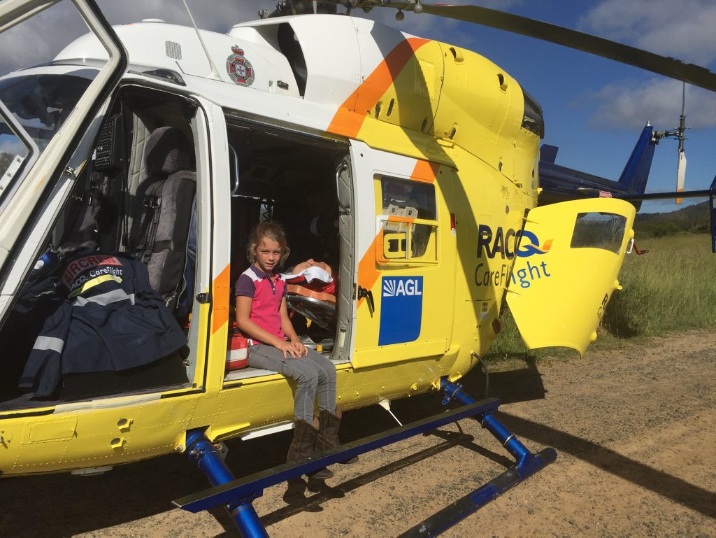 LITTLE HERO: Rylee Lavaring sitting in a RACQ CareFlight Rescue Helicopter. Photo: Max Fleet / NewsMail LITTLE HERO: Rylee Lavaring sitting in a RACQ CareFlight Rescue Helicopter. Photo: Max Fleet / NewsMail