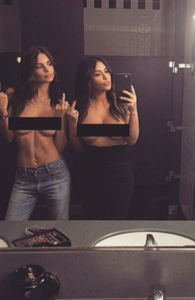 KIM Kardashian West was joined by Emily Ratajkowski in front of a bathroom mirror for the picture, in which they both held their middle fingers aloft. KIM Kardashian West was joined by Emily Ratajkowski in front of a bathroom mirror for the picture, in which they both held their middle fingers aloft.
