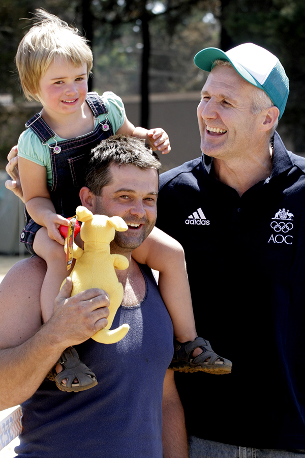 Ex-basketball player Andrew Gaze, speaks with Gavin Hodgson and his daughter Jessica, 3, both of Kinglake, at Kinglake, north of Melbourne, Tuesday, Feb. 17, 2009. A group of Olympians visited the bushfire region to meet the locals and hand out Olympic memorabilia in the aftermath of bushfires which claimed the lives of at least 189 people. Ex-basketball player Andrew Gaze, speaks with Gavin Hodgson and his daughter Jessica, 3, both of Kinglake, at Kinglake, north of Melbourne, Tuesday, Feb. 17, 2009. A group of Olympians visited the bushfire region to meet the locals and hand out Olympic memorabilia in the aftermath of bushfires which claimed the lives of at least 189 people.