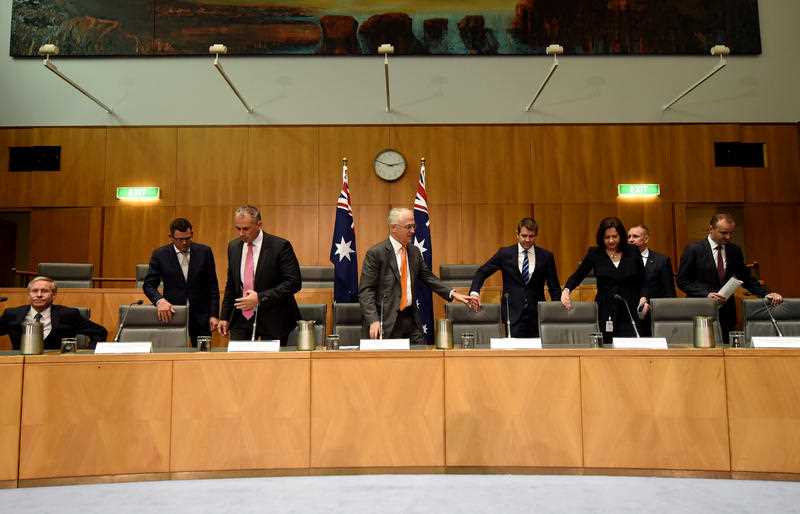 Australian Prime Minister Malcolm Turnbull together with the Premiers and Chief Ministers take their seats during a press conference after the COAG meeting at Parliament House in Canberra, Friday, April 1, 2016. Australian Prime Minister Malcolm Turnbull today met with Premiers and Chief Minister for the Council of Australian Governments. Australian Prime Minister Malcolm Turnbull together with the Premiers and Chief Ministers take their seats during a press conference after the COAG meeting at Parliament House in Canberra, Friday, April 1, 2016. Australian Prime Minister Malcolm Turnbull today met with Premiers and Chief Minister for the Council of Australian Governments.