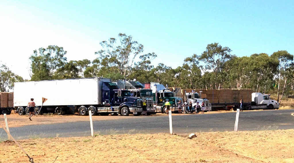 Trucks from the Burrumbuttock hay run wait to join the convoy in Augathella. Trucks from the Burrumbuttock hay run wait to join the convoy in Augathella.
