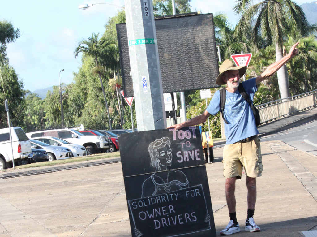 SILENT PROTEST: John Partridge hopes his sign on East St intersection will make drivers think about the new road transport industry legislation. SILENT PROTEST: John Partridge hopes his sign on East St intersection will make drivers think about the new road transport industry legislation.