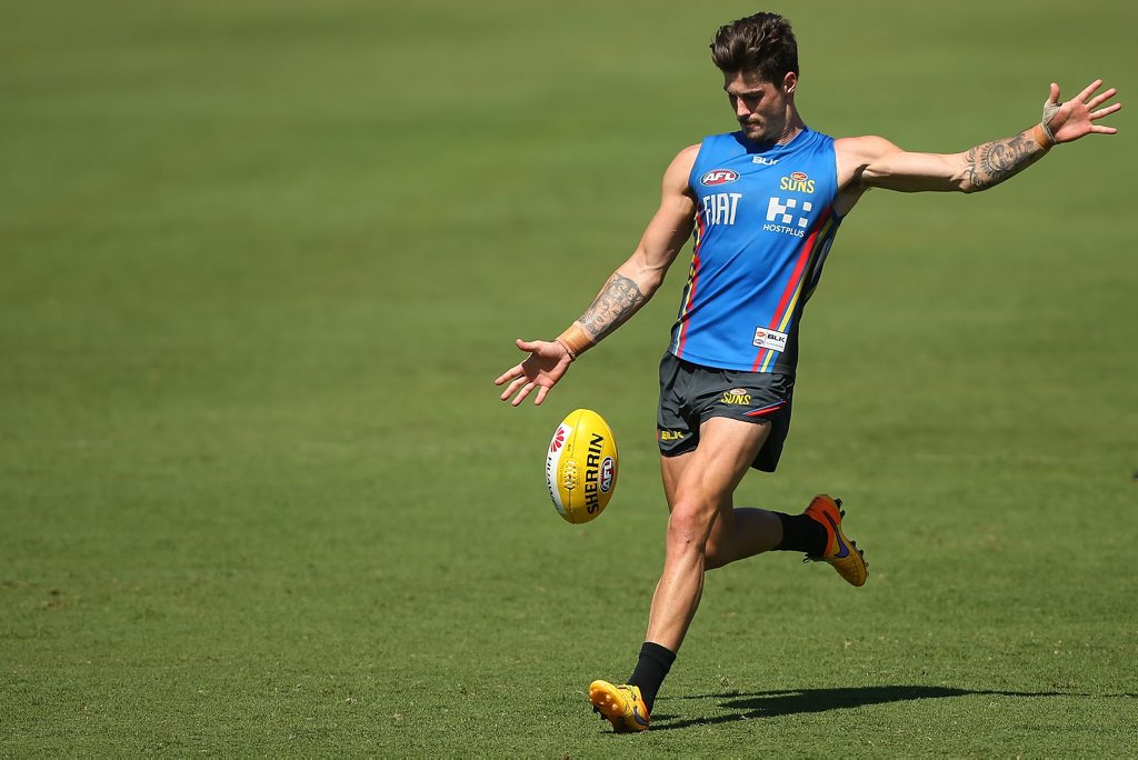 Running hot ... Alex Sexton kicks during a Gold Coast training session at Metricon Stadium this week. Photo: Chris Hyde/Getty Images Running hot ... Alex Sexton kicks during a Gold Coast training session at Metricon Stadium this week. Photo: Chris Hyde/Getty Images