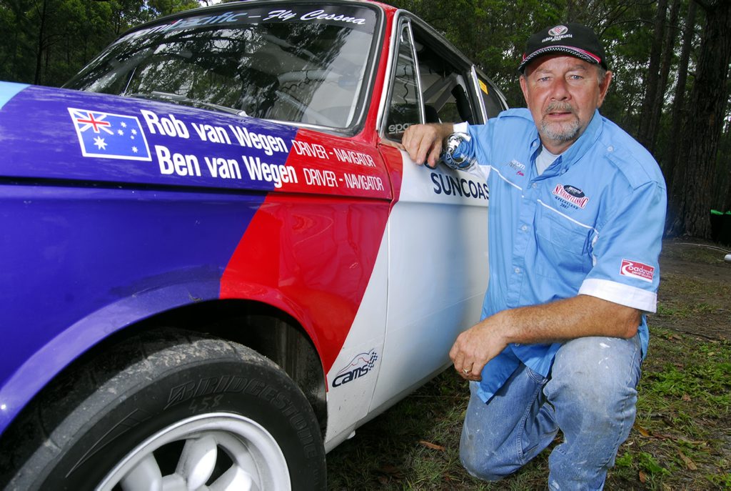 Rob van Wegen (pictured in 2007) with his classic BMW 2002 Ti racer. The Noosa racer and co-driver son Ben have both sustained leg injuries on day one of the 2016 Targa Tasmania tarmac rally. Rob van Wegen (pictured in 2007) with his classic BMW 2002 Ti racer. The Noosa racer and co-driver son Ben have both sustained leg injuries on day one of the 2016 Targa Tasmania tarmac rally.