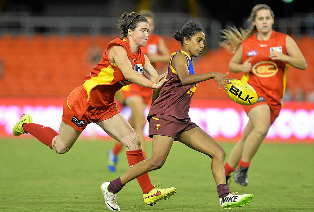 PLAYING LIKE GIRLS: Shaleise Law in action for the Lions during an exhibition hit-out with the Suns at Metricon Stadium last year, and (inset) Craig Starcevich. PLAYING LIKE GIRLS: Shaleise Law in action for the Lions during an exhibition hit-out with the Suns at Metricon Stadium last year, and (inset) Craig Starcevich.