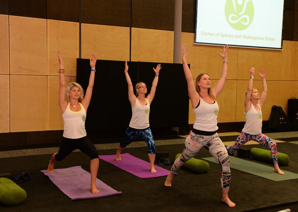 8 Limb Yoga instructors Ellie FreestonNadine Pace, owner Sue Deakin and Beth Pallesen, demonstrate different yoga routines at Mackay's Health and Fitness Expo. Photo Lee Constable / Daily Mercury