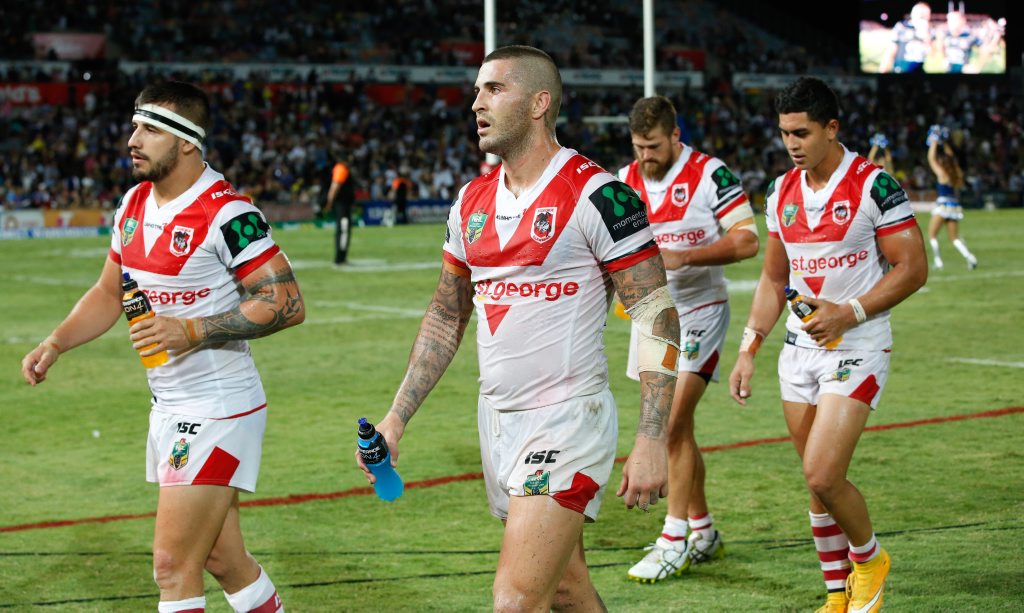 Dragons players leave the field after their 36 - 0 loss to the Cowboys. Photo: AAP Image/Michael Chambers. Dragons players leave the field after their 36 - 0 loss to the Cowboys. Photo: AAP Image/Michael Chambers.