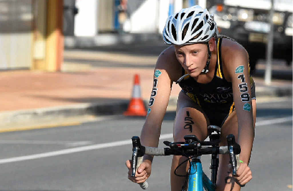 CHAMP: WA’s Jessica Claxton comfortably won the senior female class. She is pictured during the bike leg. Scan the code (inset) for more stories, photos and videos from the event. CHAMP: WA’s Jessica Claxton comfortably won the senior female class. She is pictured during the bike leg. Scan the code (inset) for more stories, photos and videos from the event.