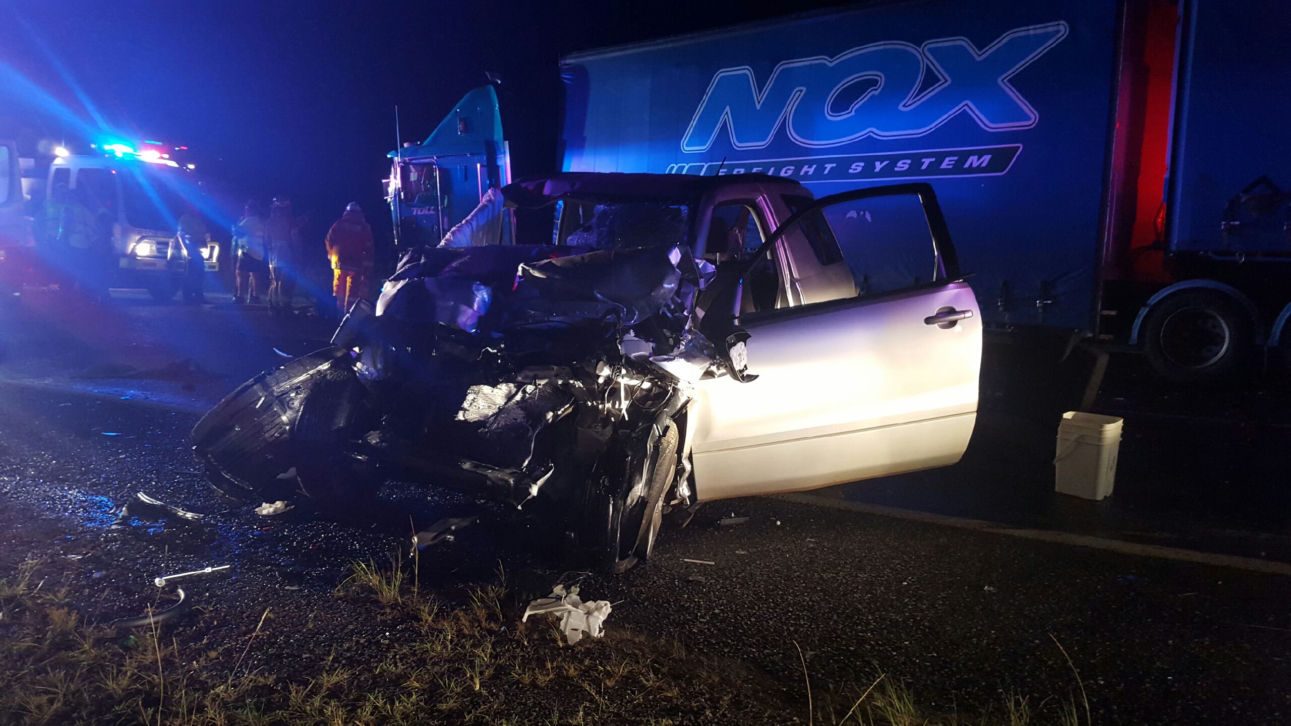 The shell of a Suzuki SUV after it collided with a B-double truck on the Pacific Highway near Highway Creek on Saturday morning. Photo: Frank Redward The shell of a Suzuki SUV after it collided with a B-double truck on the Pacific Highway near Highway Creek on Saturday morning. Photo: Frank Redward
