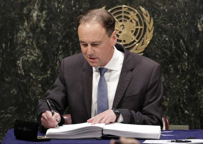 Greg Hunt, Australia's Minister of the Environment, signs the Paris Agreement on climate change, Friday, April 22, 2016 at U.N. headquarters. Greg Hunt, Australia's Minister of the Environment, signs the Paris Agreement on climate change, Friday, April 22, 2016 at U.N. headquarters.