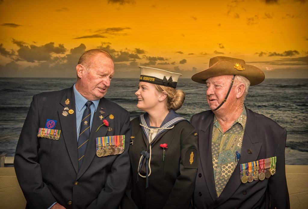 At the Yamba Anzac Day dawn service Jessica Gunning (centre) who serves on HMAS Sirius, came back to Yamba to march with her grandfathres Bob Gunning (left) and Bary de Bomfrod, who served in Vietnam. At the Yamba Anzac Day dawn service Jessica Gunning (centre) who serves on HMAS Sirius, came back to Yamba to march with her grandfathres Bob Gunning (left) and Bary de Bomfrod, who served in Vietnam.
