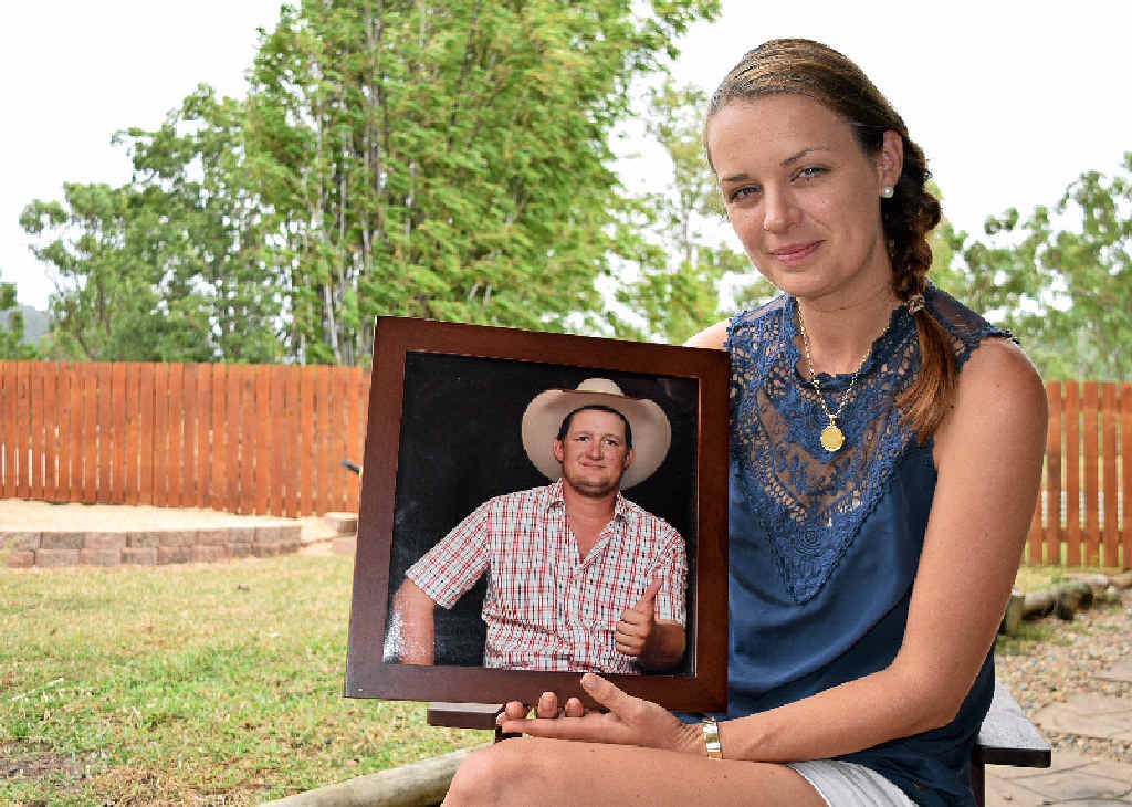 ALWAYS REMEMBERED: Amanda Golding holds a photo of her late fiance Bryson Mayne, who died in a workplace accident in 2014. ALWAYS REMEMBERED: Amanda Golding holds a photo of her late fiance Bryson Mayne, who died in a workplace accident in 2014.