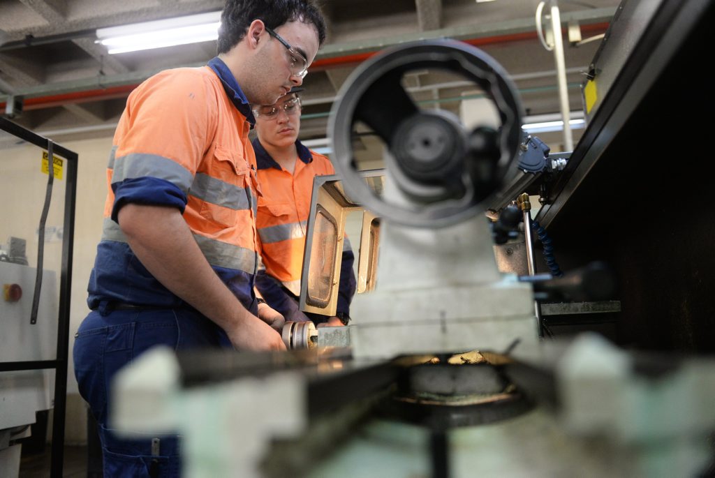 TAFE TRAINING: Apprentices Nick Wood and Bailey Huth on the lathe. Photo: Mike Knott / NewsMail TAFE TRAINING: Apprentices Nick Wood and Bailey Huth on the lathe. Photo: Mike Knott / NewsMail